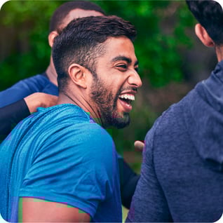a man smiling with his friend