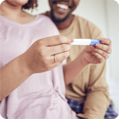 A couple looking at a pregnancy test