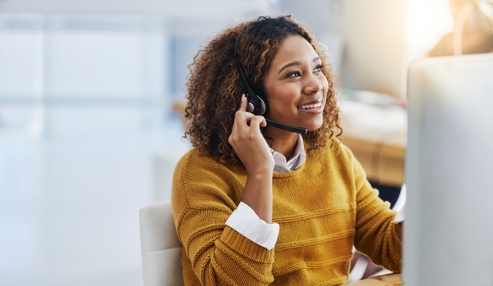 Employee accessing confidential Employee Assistance Programme support through a professional helpline and digital wellbeing service.