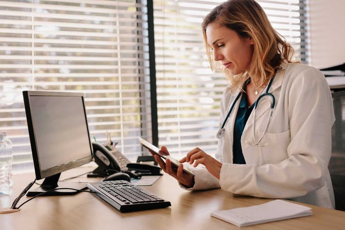 Female doctor using phone