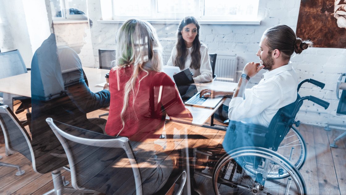 people sitting on an office talking