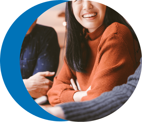 Woman looking at someone and laughing