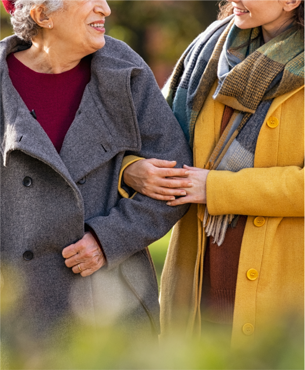 Lady supporting older woman-1