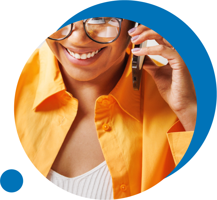 Person smiling whilst on the phone