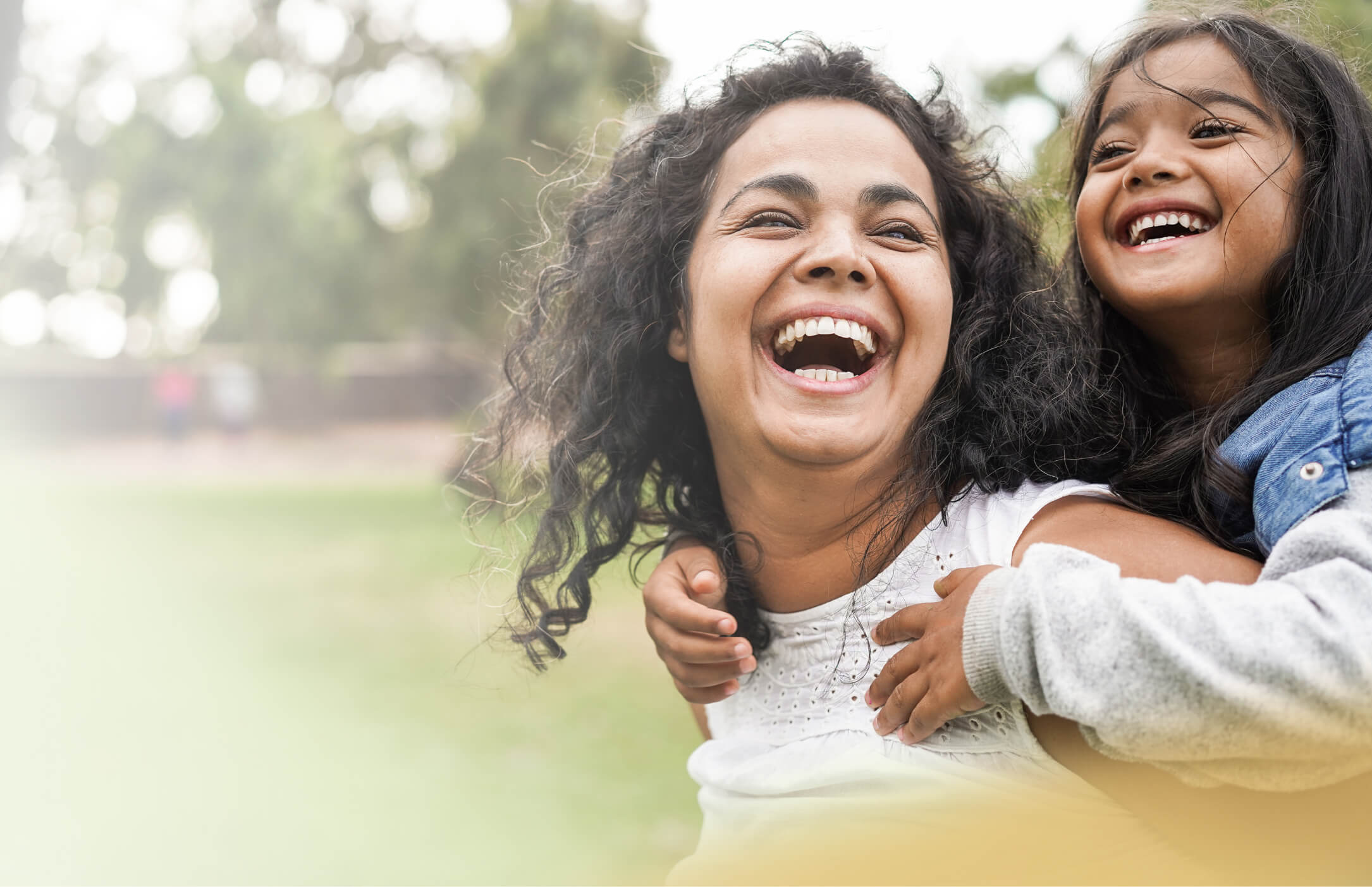 Mother and daughter smiling together