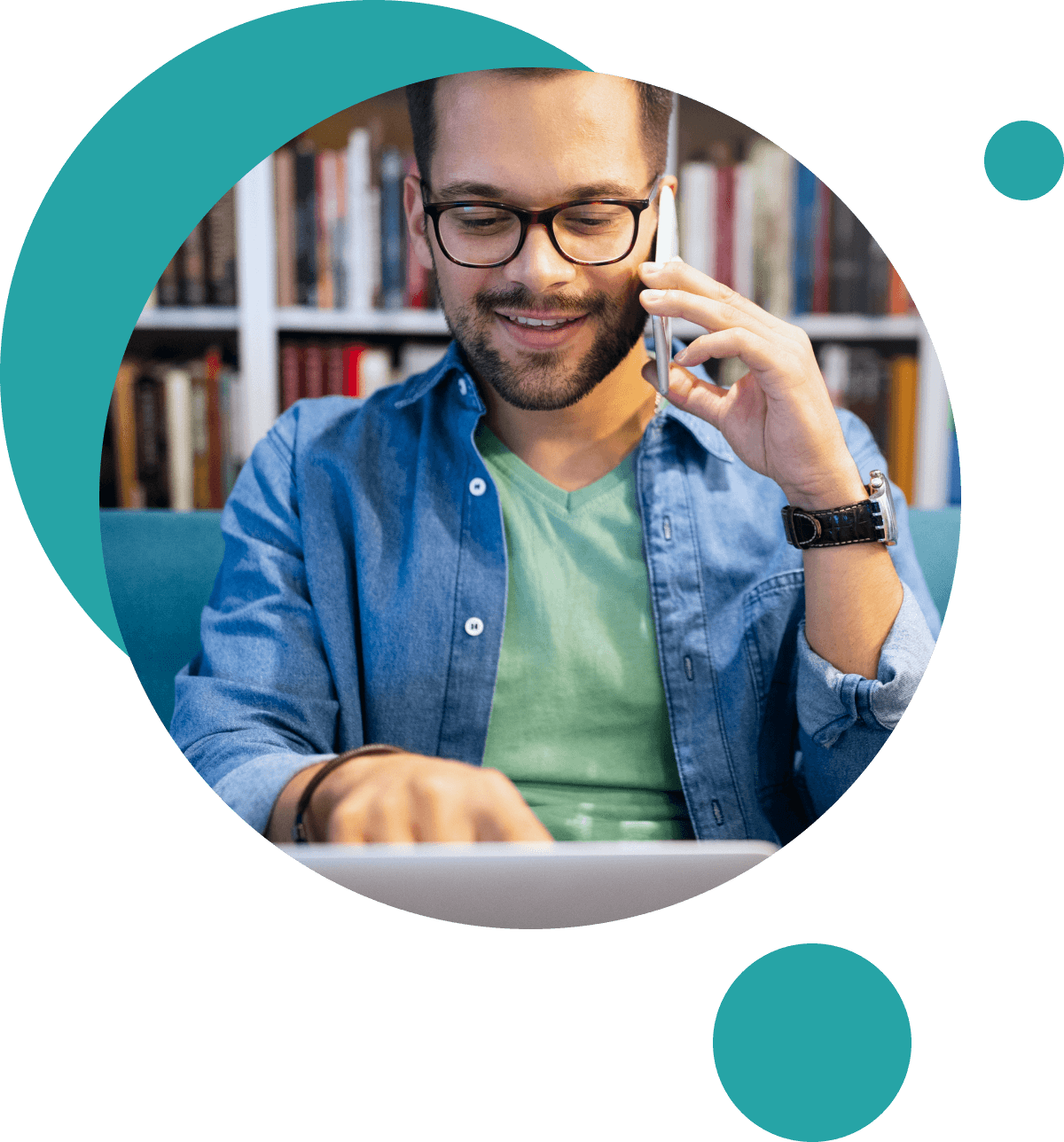 young man using phone while studying